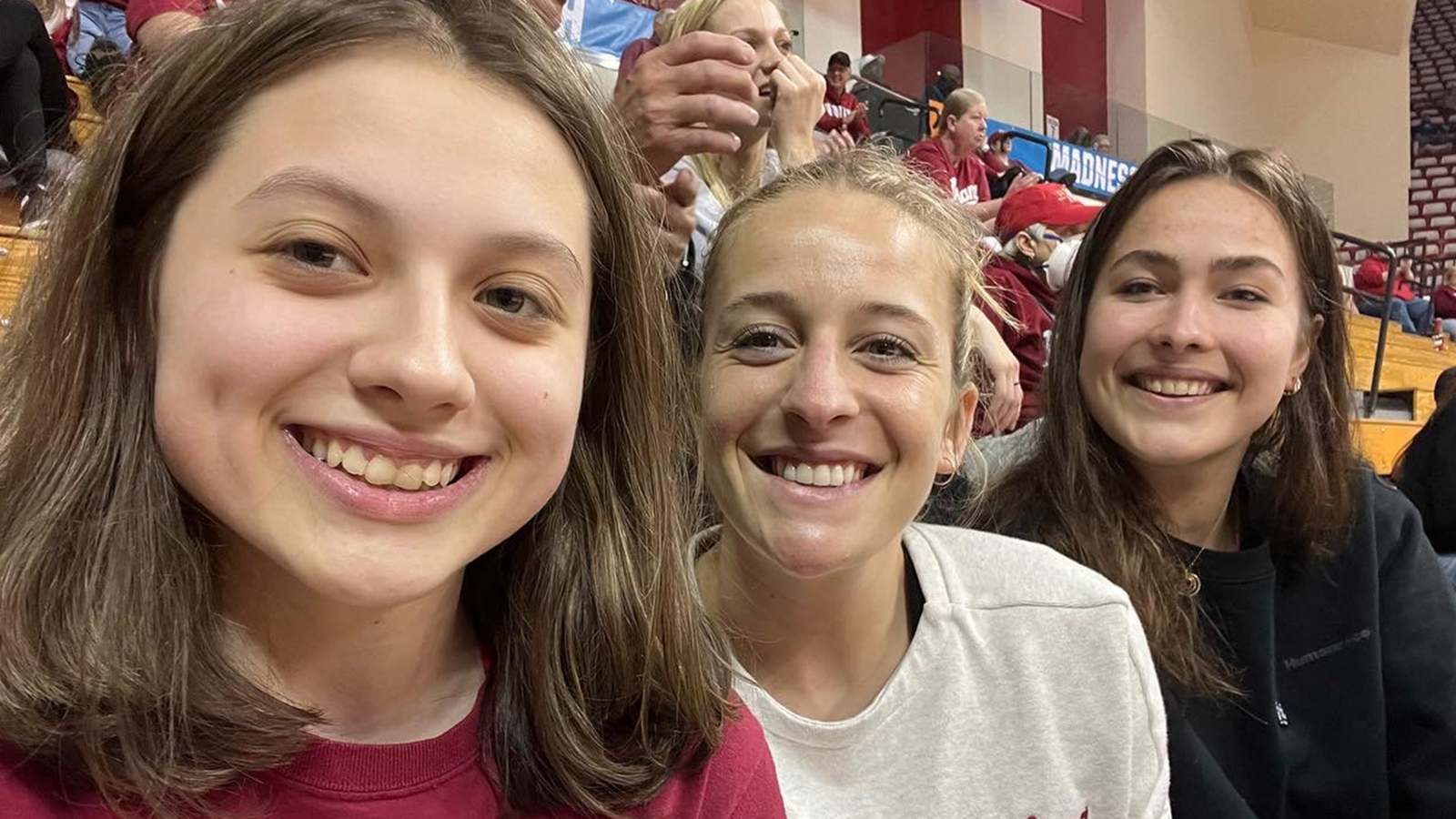 Three women at an IU women's basketball game